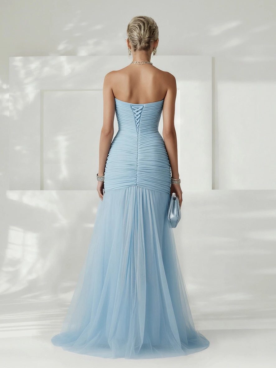 Women's elegant strapless pleated maxi dress, a sophisticated option for wedding guest attire.