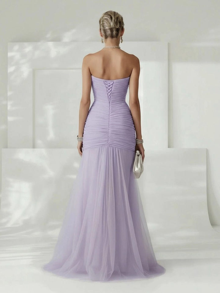 Fashionable women's strapless pleated maxi dress, versatile for formal or semi-formal occasions.