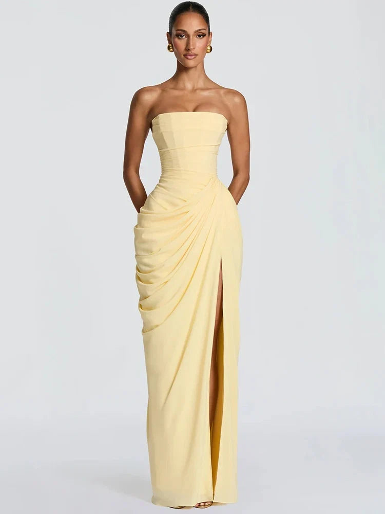Chic women's strapless evening maxi dress. Features ruched bodice & high slit for a sophisticated, elegant look.