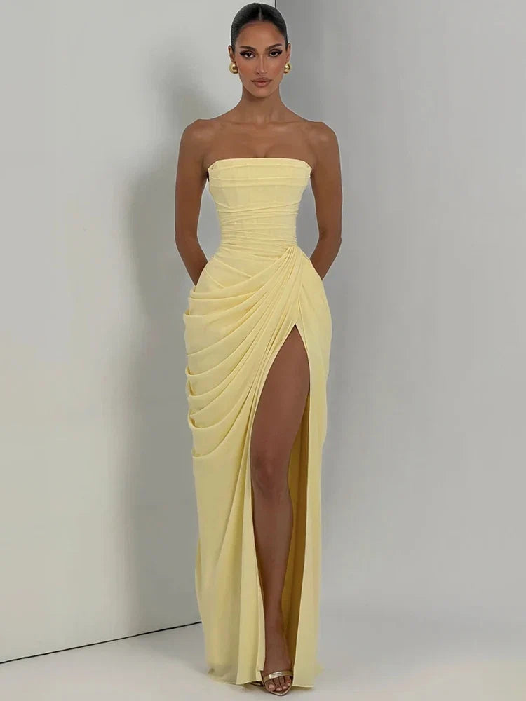 Figure-flattering women's strapless ruched maxi dress. High slit adds elegance, ideal for formal and party wear.