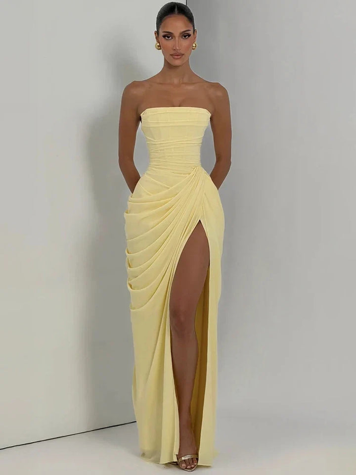 Figure-flattering women's strapless ruched maxi dress. High slit adds elegance, ideal for formal and party wear.