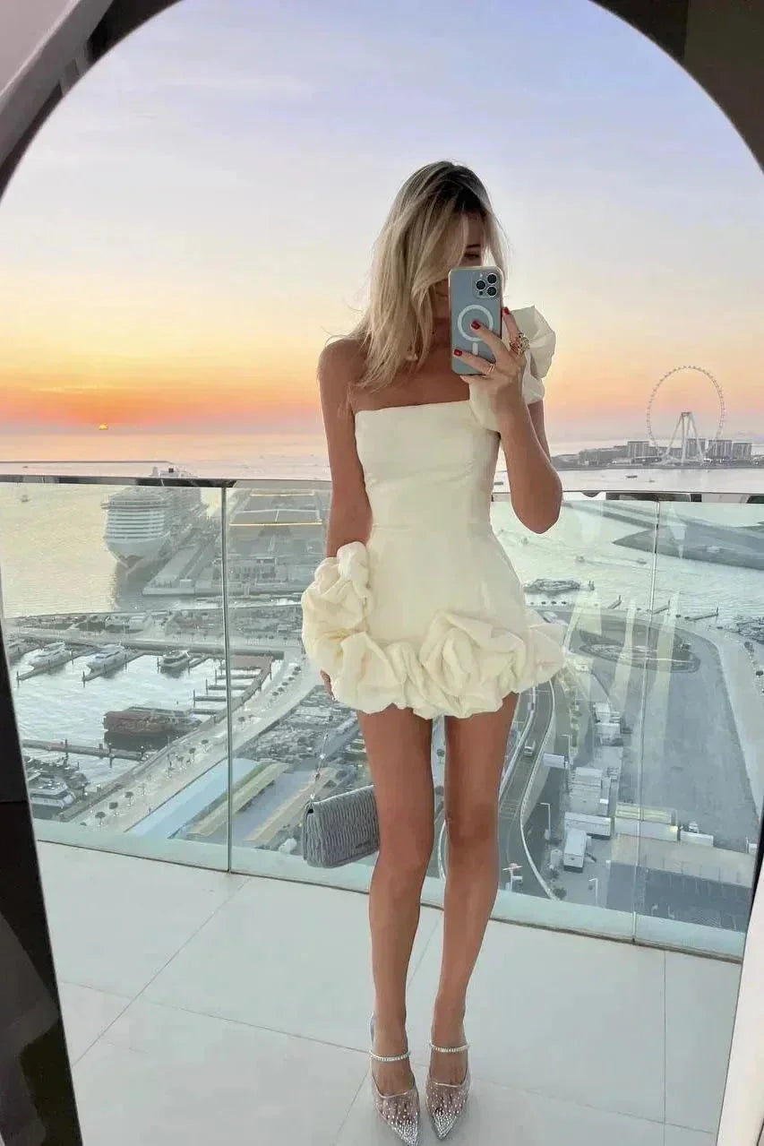 Modern bustier mini dress with ruffles, strapless design for elegant evening wear & party fashion.