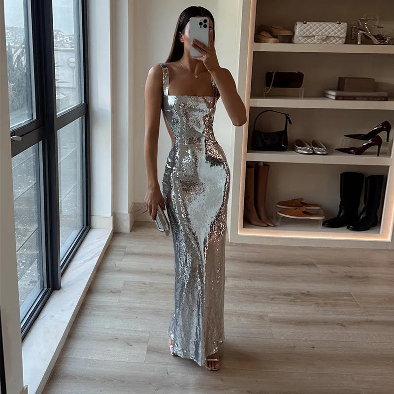 Elegant women's strapless sequin maxi dress, perfect for evening events & red carpet. Shimmering formal gown.