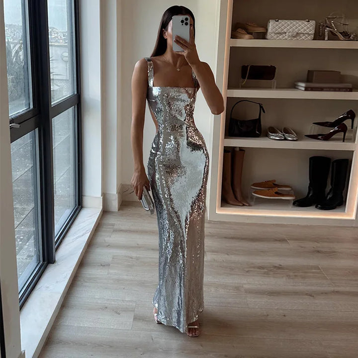 Elegant women's strapless sequin maxi dress, perfect for evening events & red carpet. Shimmering formal gown.