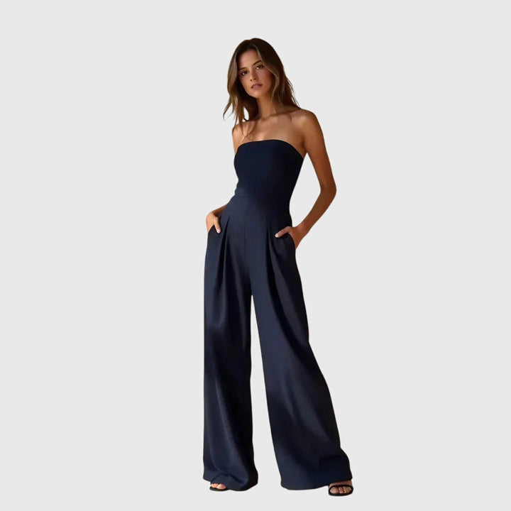Chic women's strapless wide-leg jumpsuit with elegant pleated waist, ideal for comfortable evening fashion.