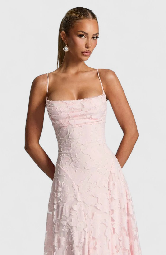 Elegant women's formal maxi dress featuring a beautiful strappy back, perfect for wedding guests.