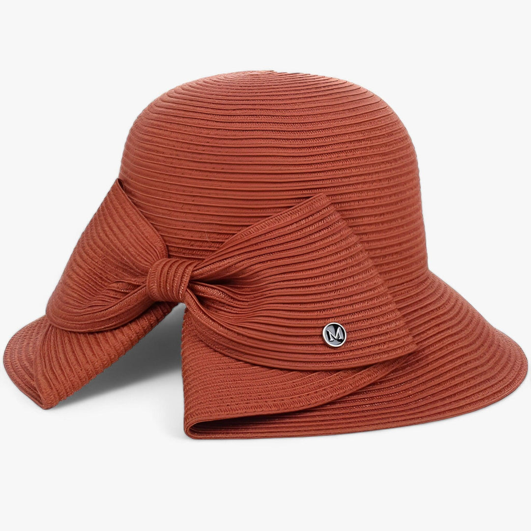 Fashionable women's straw sun hat with an elegant asymmetrical bow, a must-have summer accessory for everyday wear.