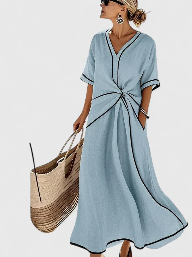 Comfortable striped midi dress for women, ideal for casual summer days or travel. Flowy, lightweight style.