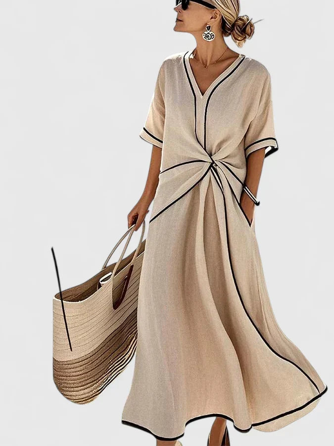 Chic women's striped summer midi dress with a flowy silhouette. Perfect elegant casual wear for vacation.
