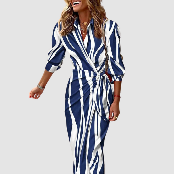 Stylish women's striped midi dress. Elegant design ideal for office wear, summer fashion, or casual occasions.