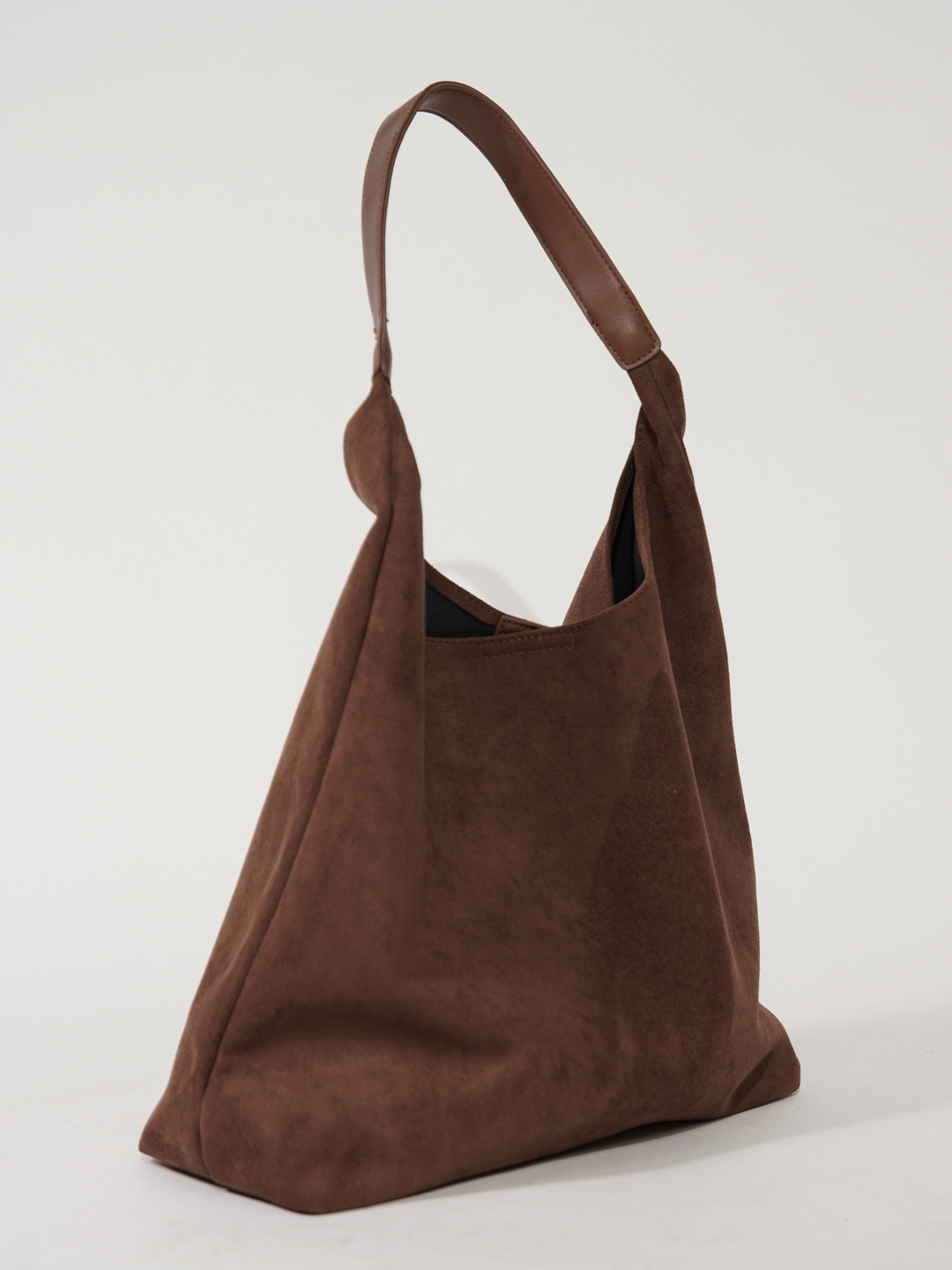 Brown elegant women's suede tote bag. Versatile everyday shoulder bag, perfect for stylish daily essentials.