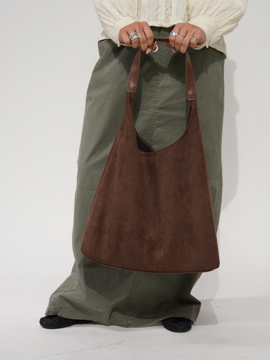 Green elegant women's suede tote bag. Versatile everyday shoulder bag, a stylish accessory for women.