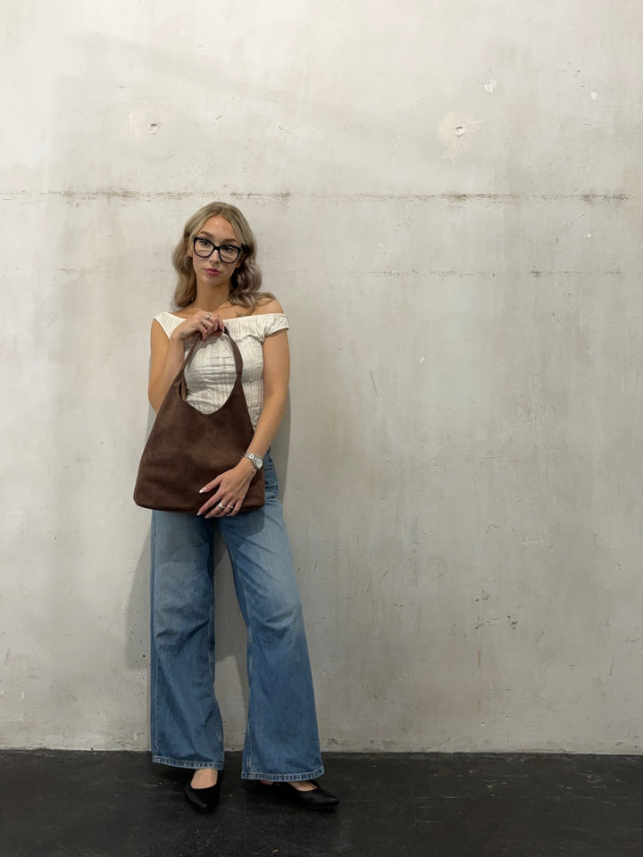 Beige elegant women's suede tote bag. Versatile large capacity shoulder bag, perfect for everyday style.