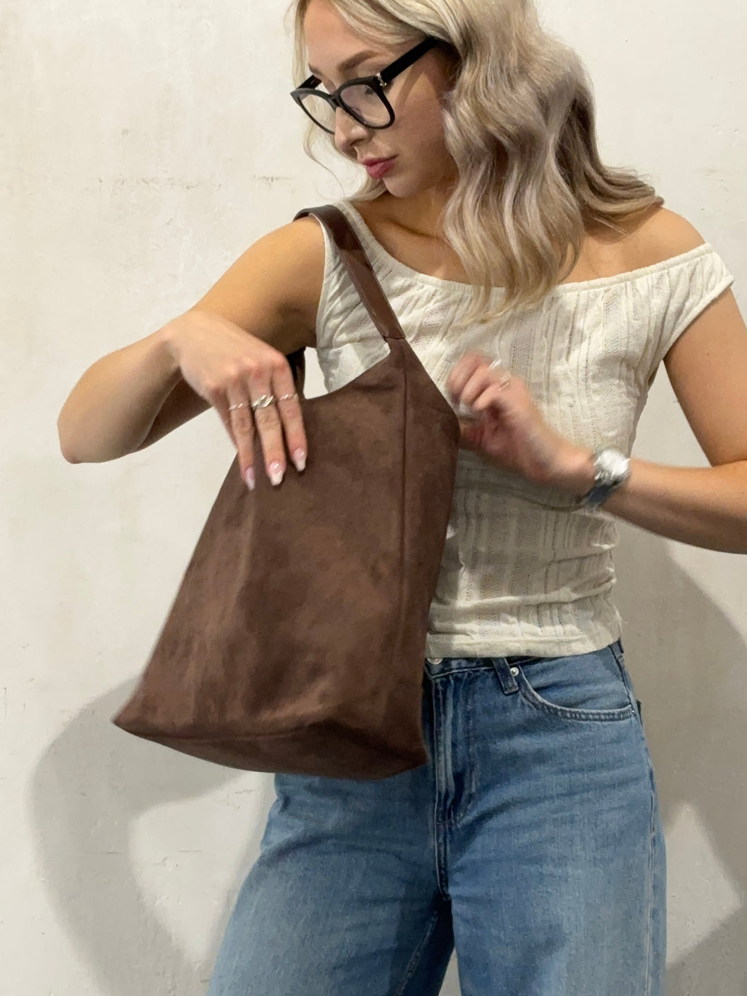 Spacious interior of elegant suede tote bag. Large capacity women's handbag, perfect for all daily essentials.