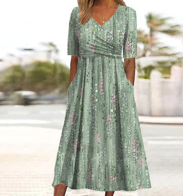 Elegant women's summer midi dress, flared, v-neck, short sleeve, with stylish print. Perfect for vacation.