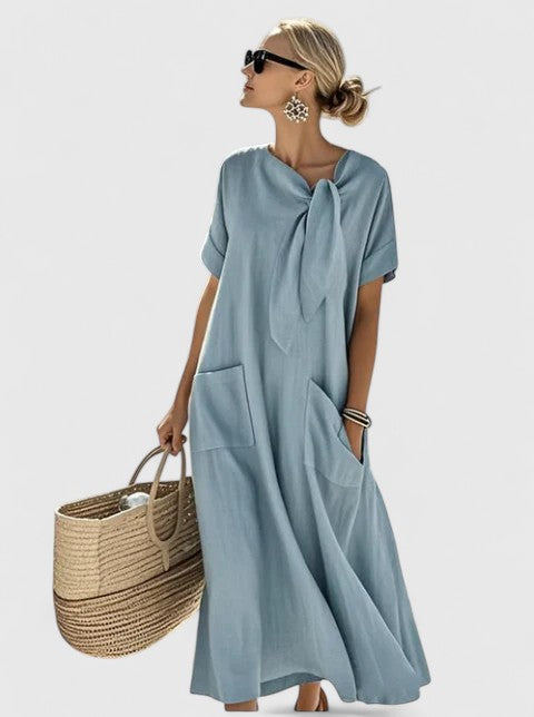 Stylish women's summer midi dress, featuring an elegant tie neck. Chic and comfortable for any occasion.