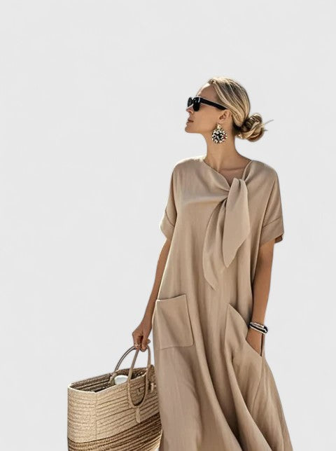 Chic women's elegant summer midi dress with tie neck. Ideal for vacation, casual outings, or stylish events.