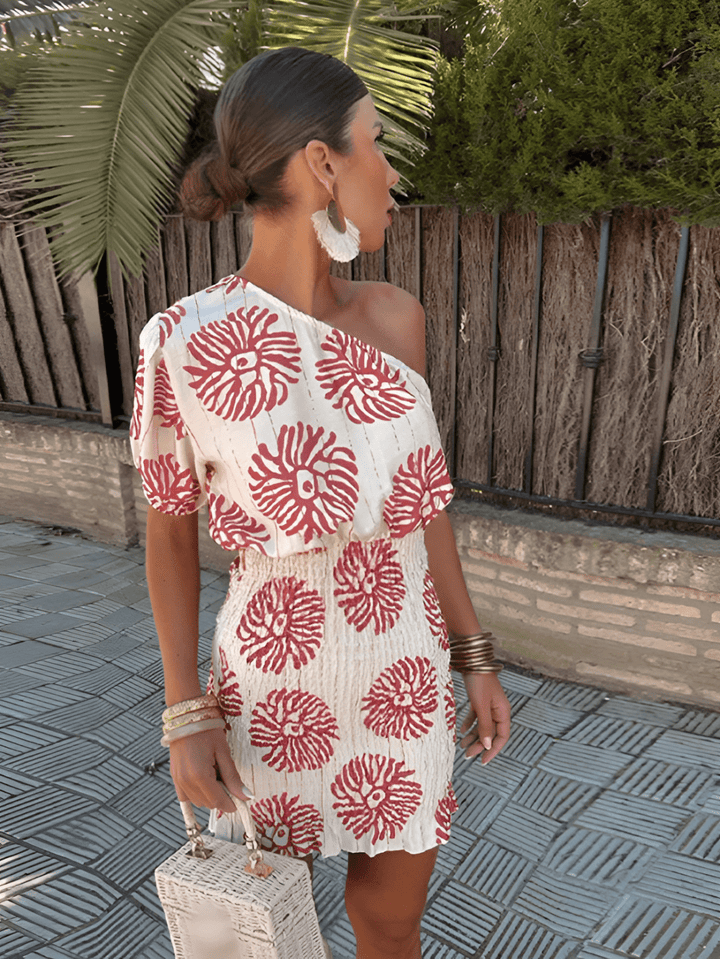 Elegant women's summer mini dress with vibrant bold prints, perfect for versatile day-to-night fashion.