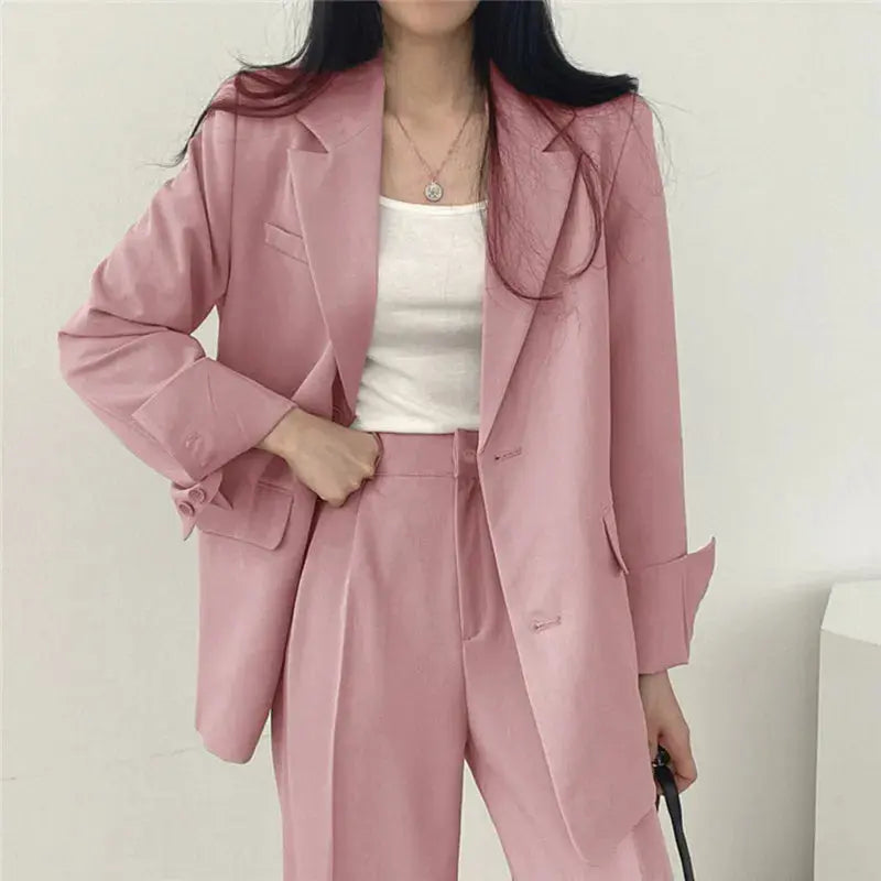 Elegant women's tailored blazer & relaxed fit trouser set, perfect for business or formal wear.