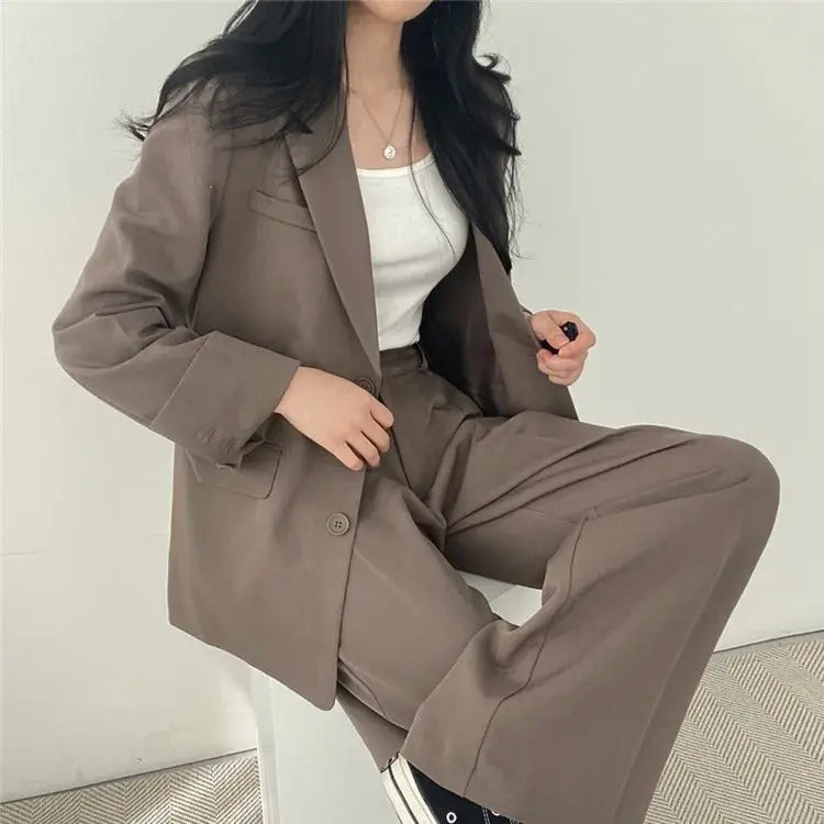 Women's two-piece office set: a stylish tailored blazer and comfortable, relaxed fit trousers.