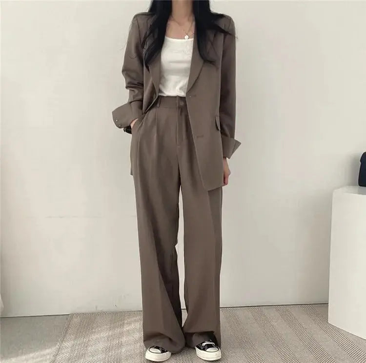Comfortable & chic: women's relaxed fit trouser set with an elegant tailored blazer for work or events.