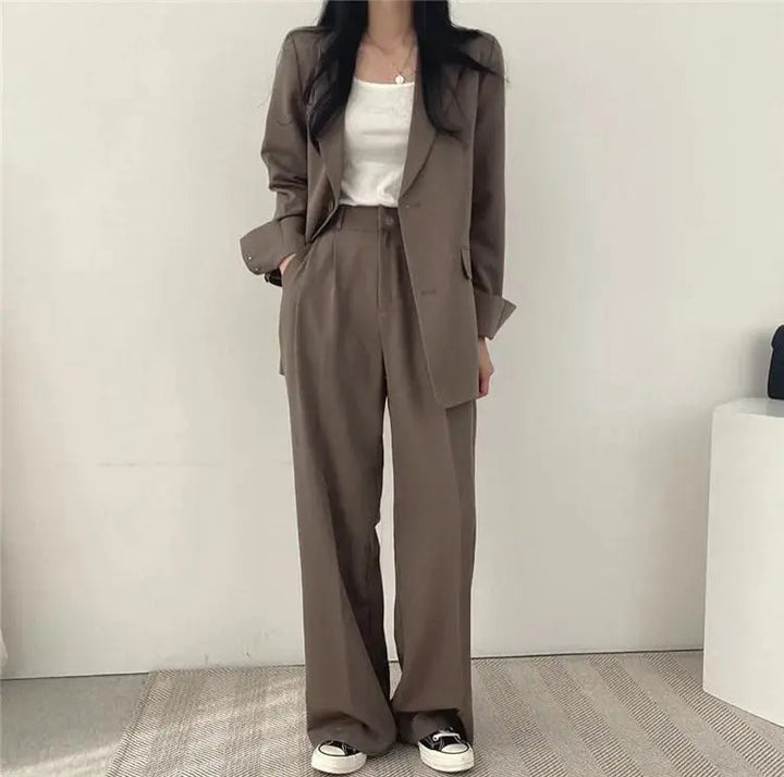 Comfortable & chic: women's relaxed fit trouser set with an elegant tailored blazer for work or events.