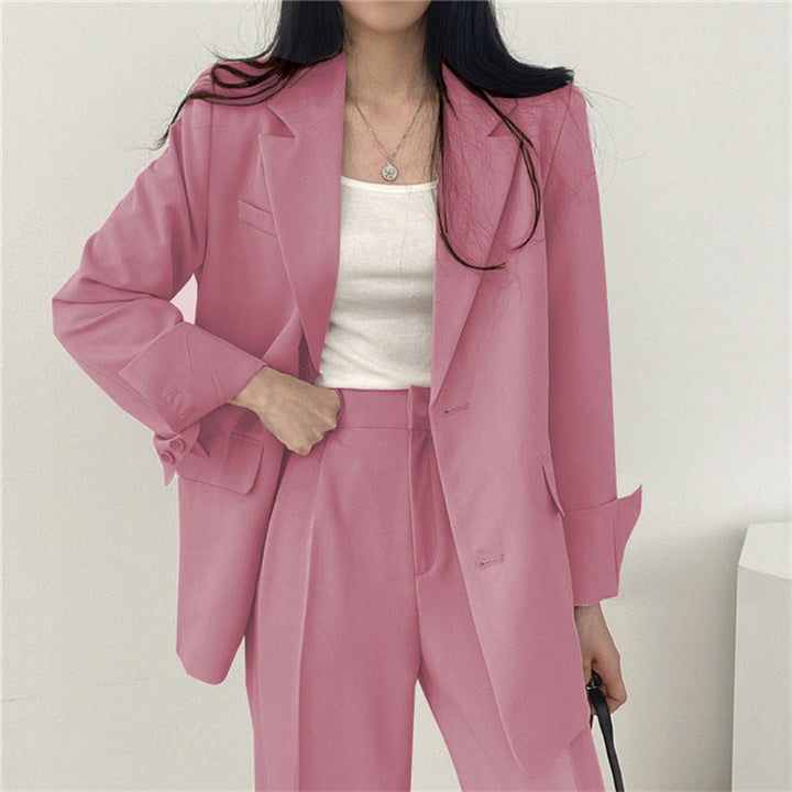 Stylish women's blazer suit with a tailored jacket and relaxed fit trousers for a modern business look.