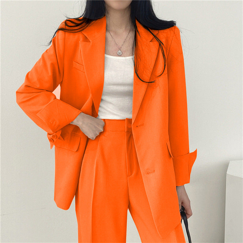 Elegant women's tailored blazer and relaxed fit trousers, a perfect two-piece set for formal or daily wear.