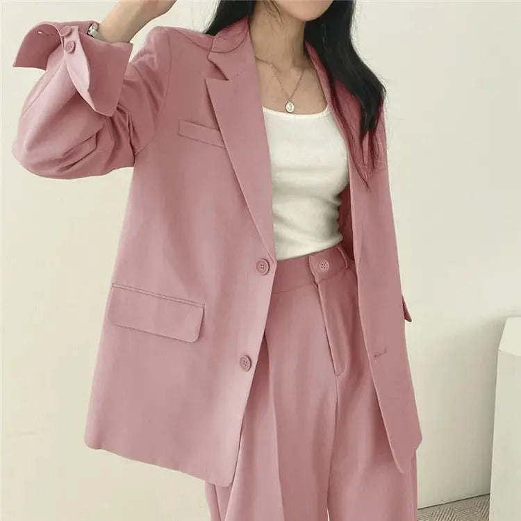 Sophisticated women's tailored blazer and relaxed trousers, a versatile elegant outfit for any occasion.