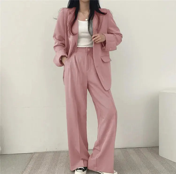 Women's business wear set: chic tailored blazer paired with comfortable relaxed fit trousers.