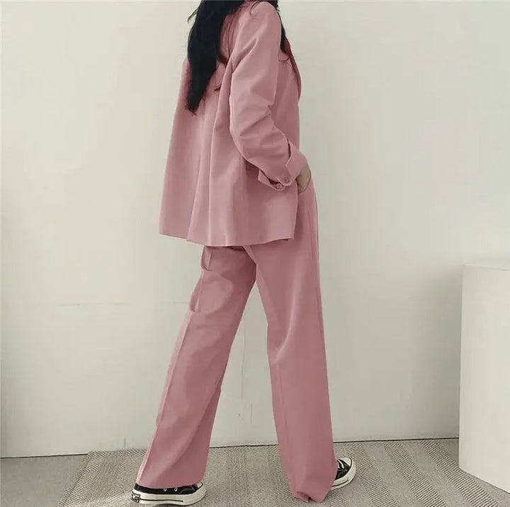 Modern women's blazer set with a tailored jacket and relaxed trousers for professional and smart casual.