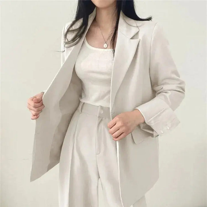 Elegant women's blazer & relaxed fit trouser suit, perfect for a polished business wear look.