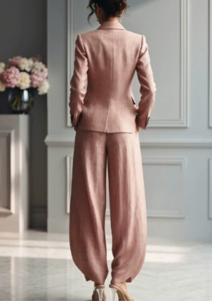 Chic women's tailored set featuring a collared blazer & comfortable pleated wide-leg trousers. Versatile workwear.