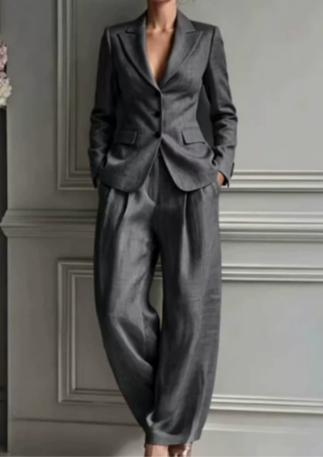 Modern women's tailored set: collared blazer and elegant pleated wide-leg pants. Perfect for work or stylish events.