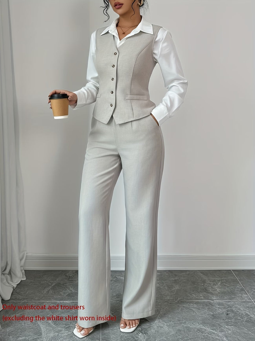 Elegant women's tailored vest & high-waist trousers set. Perfect for professional wear & smart casual fashion.