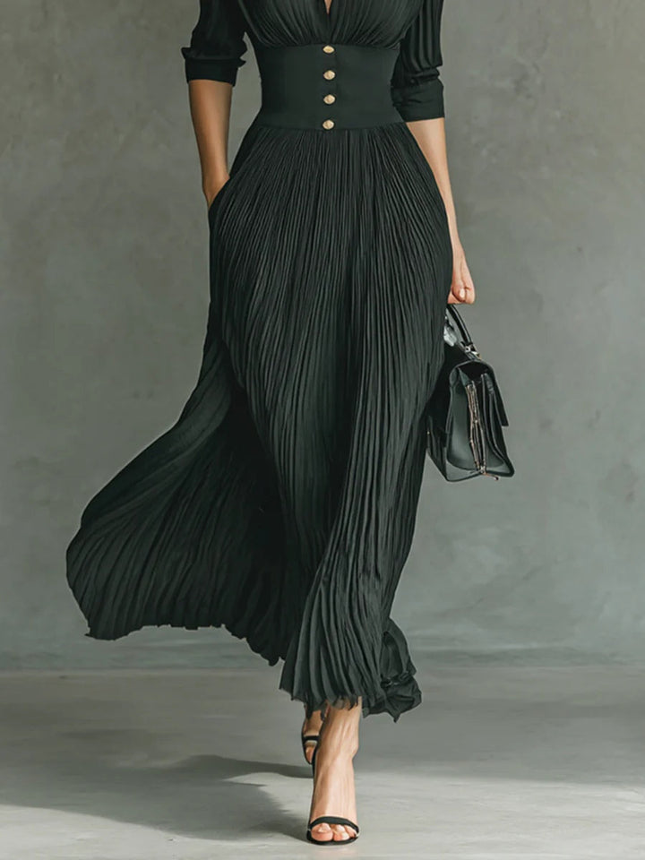 Sophisticated women's tailored maxi dress. Features a flattering cinched waist, long length, and elegant design for women.