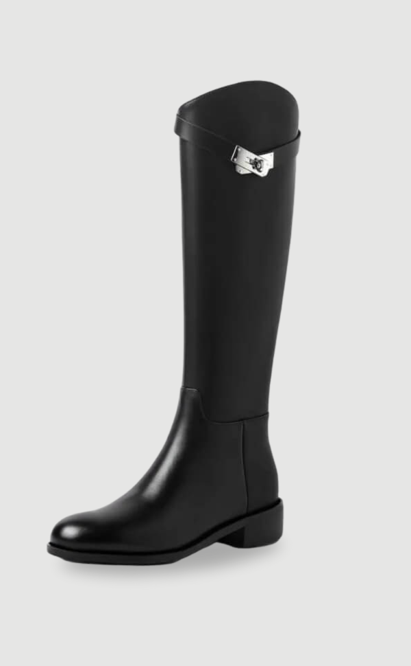 Elegant women's tall riding boots in black with stylish metal buckle detail. Perfect for winter fashion.