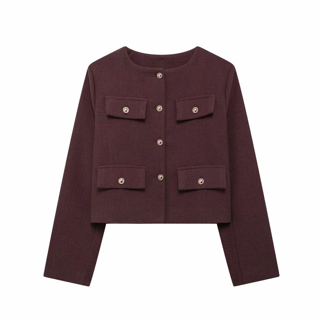 Full body shot of a woman in an elegant textured cropped button-up jacket, chic style.