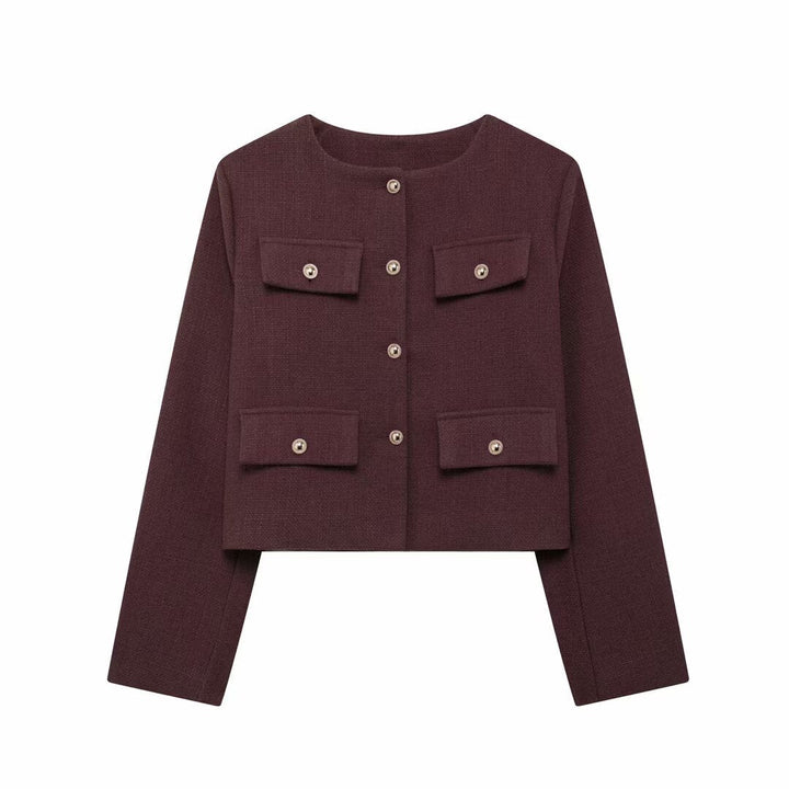 Full body shot of a woman in an elegant textured cropped button-up jacket, chic style.
