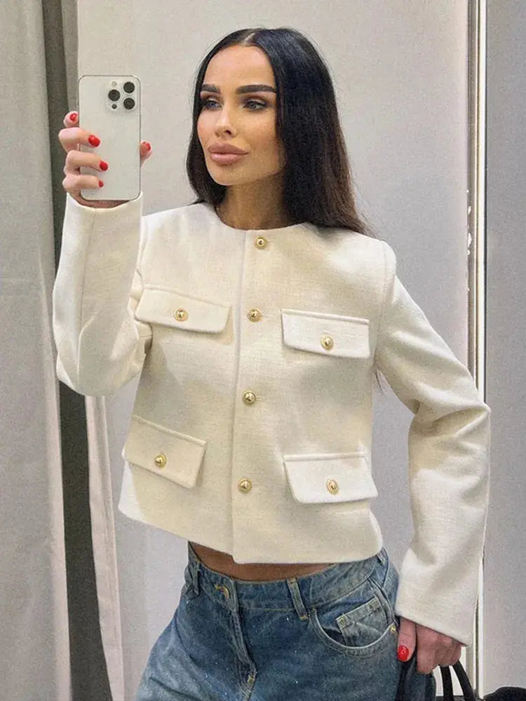 Chic women's textured cropped jacket with button-up front, ideal for spring/fall layering.