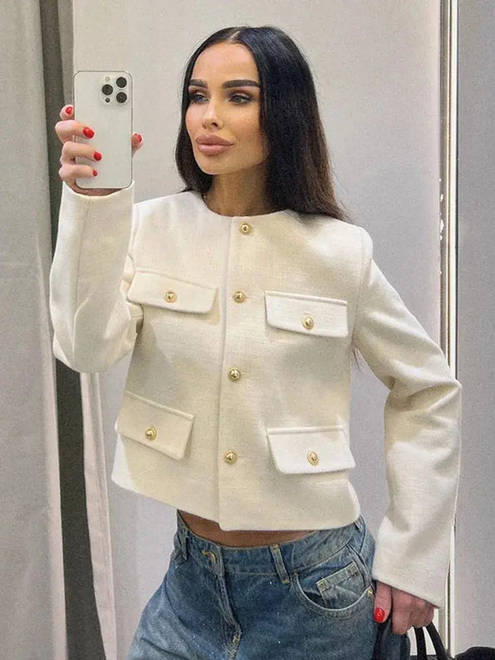 Chic women's textured cropped jacket with button-up front, ideal for spring/fall layering.