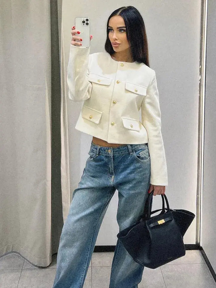 Modern round neck cropped button-up jacket for women. Elegant & versatile everyday style.
