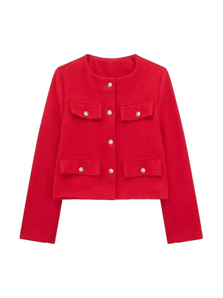 Close-up of the elegant buttons on a women's textured cropped button-up jacket.