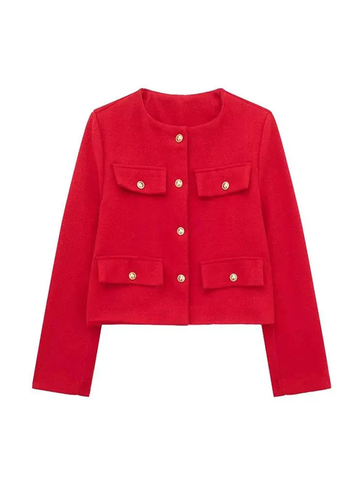 Close-up of the elegant buttons on a women's textured cropped button-up jacket.
