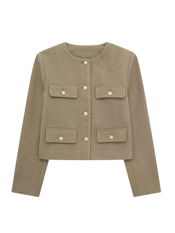 Detailed view of the sophisticated texture on an elegant women's cropped jacket.