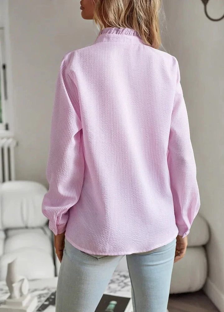 Elegant women's striped long sleeve blouse with a textured finish & ruffled collar, suitable for various occasions.