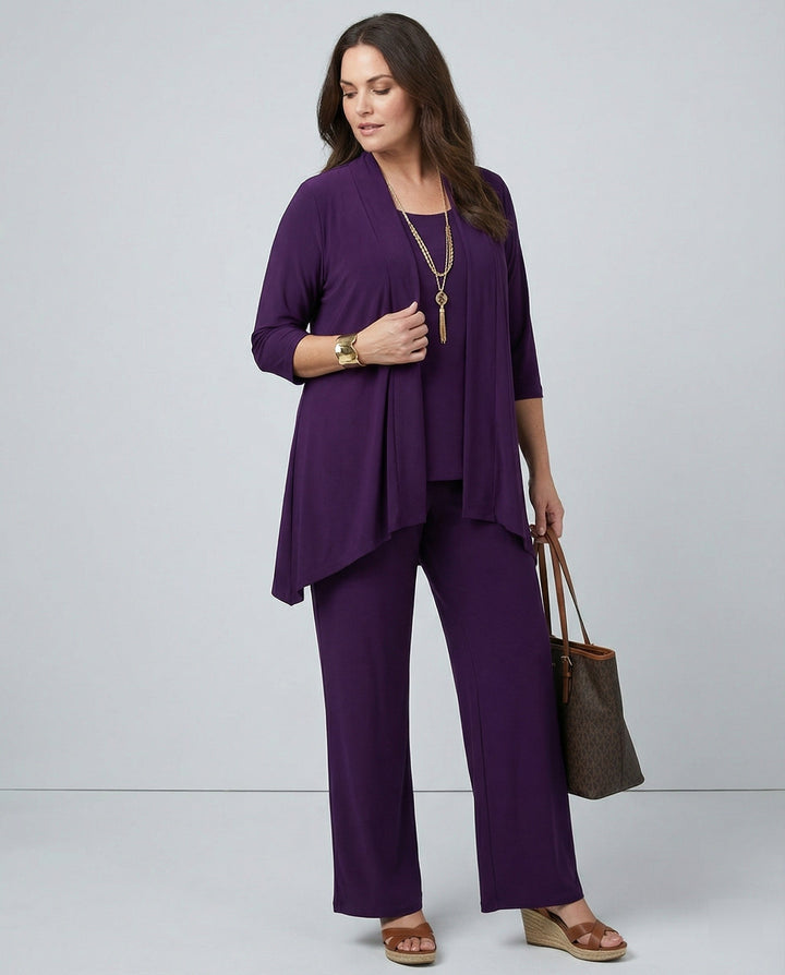 Elegant women's three-piece pantsuit, tailored blazer, vest, & trousers for professional business attire.