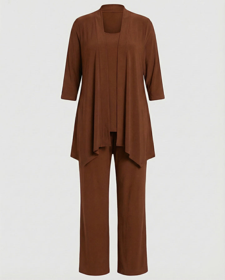 Woman wearing an elegant three-piece pantsuit, blazer, vest & trousers, for a confident professional style.