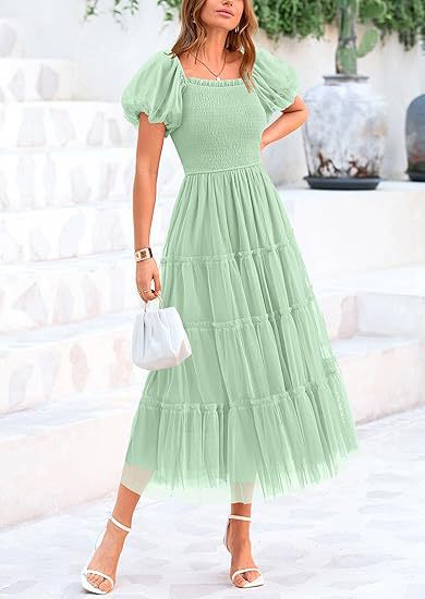 Women's formal tiered maxi dress with elegant puff sleeves. Smocked for comfort, ideal for wedding guests.