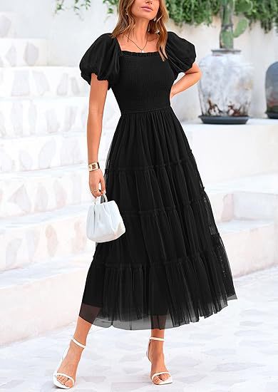Flowy smocked maxi dress with puff sleeves. Ideal elegant women's wedding guest or special occasion dress.